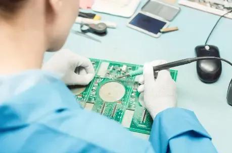 Person soldering PCB